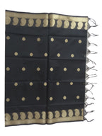 A Banarasi-inspired Black Art Silk Dupatta with Tassels by Ladylike Accoutre, displayed on a clean white background. Features gold zari butti floral motifs and an intricate paisley border.