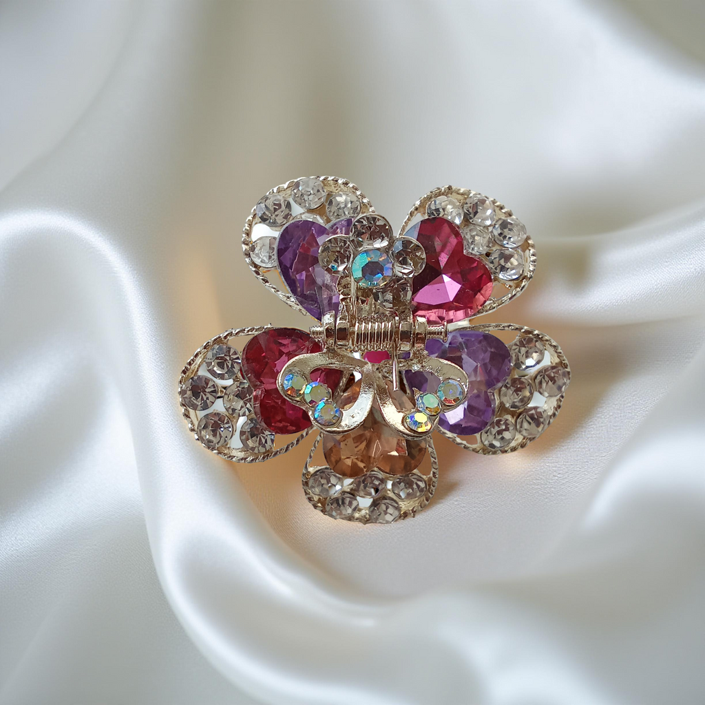 Gold-Tone Crystal Flower Hair Claw Clip in purple, red, peach, white adorned with sparkling heart-shaped crystals.