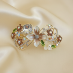 Gold-tone floral hair barrette with brown pearls and crystals, enamel petals, decorative hair clip for weddings, parties, and everyday hairstyles.