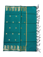 A Banarasi-inspired Peacock Green Art Silk Dupatta with Tassels by Ladylike Accoutre, displayed on a clean white background. Features gold zari butti floral motifs and an intricate paisley border.