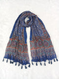 Blue Pakistani print georgette dupatta with mirror work embellishments and tassels spread out on a white surface. Curated by Ladylike Accoutre.