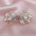 Gold-tone Pink floral bow barrette hair clip with pearls and crystal embellishments by Ladylike Accoutre.