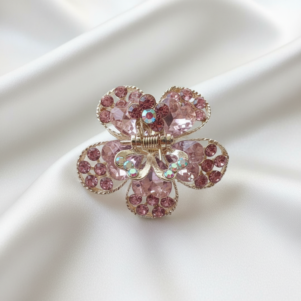 Gold-Tone Crystal Flower Hair Claw Clip in pink, adorned with sparkling heart-shaped crystals.